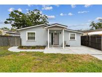 Charming single-story home with a well-maintained lawn and inviting front porch at 4465 56Th N Ave, St Petersburg, FL 33714