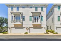 Charming townhome featuring a modern design, private balconies, and convenient garage access at 4757 Legacy Park Dr, Tampa, FL 33611