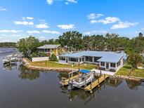 Beautiful waterfront home featuring a private boat dock and stunning water views from nearly every room at 100 18Th Nw St, Ruskin, FL 33570