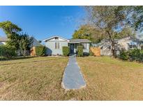 Charming single-story home featuring a well-maintained lawn, tidy landscaping, and a welcoming front entrance at 2035 29Th N Ave, St Petersburg, FL 33713
