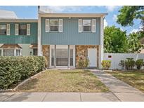 Charming two-story home featuring stone accents and a well-maintained front lawn at 3413 W Kirby St, Tampa, FL 33614