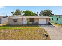 Charming single-story home with a well-maintained front yard and inviting curb appeal at 3640 Cheswick Dr, Holiday, FL 34691