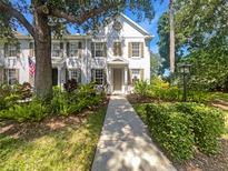 Charming townhome featuring lush landscaping, a welcoming walkway and a neutral color palette at 5636 Whitehead St, Bradenton, FL 34203