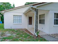 Cozy single-story home with a textured stucco exterior and decorative support post at 1262 Jeffords St, Clearwater, FL 33756