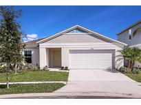 Charming single-Gathering home with well-manicured lawn and attached two-car garage at 14815 Summer Branch Dr, Lithia, FL 33547