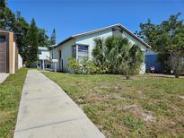 Charming single-story home with a walkway and front yard at 2510 Queen S St, St Petersburg, FL 33712