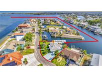 Aerial view of waterfront home with Gulf access, surrounded by canals at 3181 Gulf Winds Cir, Hernando Beach, FL 34607