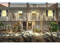 Charming townhome featuring a cozy facade, garden, and a well-lit entrance at 5435 Sweetwater Terrace Cir, Tampa, FL 33634