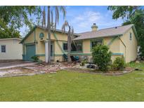 Charming single Gathering home featuring a front yard, garden, and pleasant curb appeal at 6028 Central Ave, New Port Richey, FL 34653