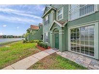 Inviting green townhome with lake view and meticulously maintained landscaping at 9602 Lake Chase Island Way # 9602, Tampa, FL 33626