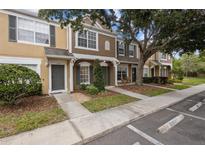 Charming townhome featuring neutral colors and well-maintained landscaping in a desirable community at 1118 Kennewick Ct, Wesley Chapel, FL 33543