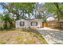 Charming single-story home featuring a well-maintained yard and a private driveway at 1404 E Curtis St, Tampa, FL 33603