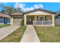 Charming single-story home with a well-manicured lawn and a cozy, inviting front porch at 3613 21St S Ave, St Petersburg, FL 33711