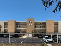 The Yorktown condo building with a well-maintained exterior and covered parking at 7910 Sun Island S Dr # 404, South Pasadena, FL 33707