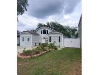 Charming single-Gathering home featuring a landscaped front yard and inviting curb appeal at 8207 Volusia Pl, Tampa, FL 33637