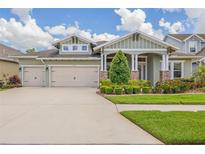 Charming single-Gathering home with a well-manicured lawn and a three-car garage at 16712 Courtyard Loop, Land O Lakes, FL 34638