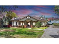 Charming home featuring a landscaped front yard and inviting entrance at 2621 Stearns Rd, Valrico, FL 33596
