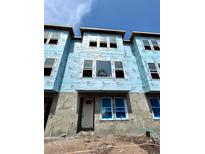 New townhouse exterior showcasing a modern design with large windows and durable WeatherMate Plus house wrap at 479 31St N Way, St Petersburg, FL 33713