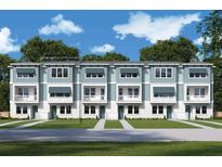 Charming townhouse boasts a modern facade, complemented by a well-manicured lawn and inviting entryway at 479 31St N Way, St Petersburg, FL 33713