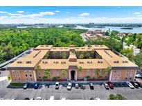 Expansive aerial view of the condo complex near lush greenery and waterways at 12760 Indian Rocks Rd # 578, Largo, FL 33774
