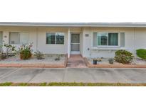 Charming single story home featuring a well-maintained exterior with landscaped front yard and welcoming entrance at 1304 Burbank Ct, Sun City Center, FL 33573