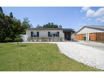 Charming single-story home featuring a well-manicured lawn and a welcoming front entrance at 3315 W Pearl Ave, Tampa, FL 33611