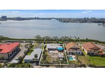 Waterfront home lot outlined in white with skyline in background at 7075 Sunset S Dr, South Pasadena, FL 33707
