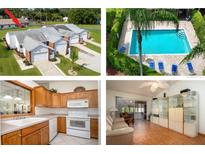 Aerial shot of townhomes with a pool and landscaping at 3010 Beecher E Dr # A, Palm Harbor, FL 34683