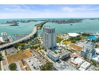 Beautiful aerial view showcasing the city skyline and the condo's prime waterfront location with bridge access at 331 Cleveland St # 906, Clearwater, FL 33755