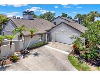 Charming single-Gathering home with a well-manicured lawn and beautiful landscaping at 4694 Huron Rd, St Petersburg, FL 33708