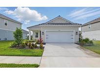 Charming single-story home boasting a well-manicured lawn and a spacious driveway with ample parking at 6281 Dry Tortugas Dr, Sarasota, FL 34241