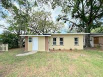 Charming single-story home with mature trees and a well-maintained front yard at 1536 S Martin Luther King Jr Ave, Clearwater, FL 33756