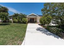 Charming home with a well-manicured lawn and decorative front door at 4055 Floramar Ter, New Port Richey, FL 34652
