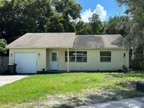Charming single-story home with a well-maintained front yard and attached garage at 650 Palm Pl, Safety Harbor, FL 34695