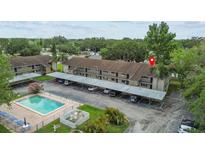 Inviting complex with a pool and convenient covered parking spaces for residents at 9821 113Th St # 201, Seminole, FL 33772