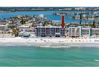 Stunning beachfront condo offering panoramic ocean views and direct access to the sandy beach at 14300 Gulf Blvd # 401, Madeira Beach, FL 33708