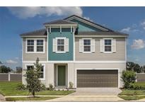 Charming two-story home features a neutral color palette, an attached two car garage and well maintained lawn at 10017 Surrey Rose Dr, San Antonio, FL 33576