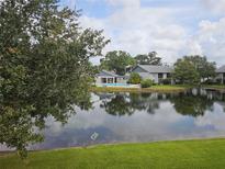 Scenic view of pond and community pool, creating a tranquil setting for these apartment homes at 11201 122Nd Ave # 126, Largo, FL 33778
