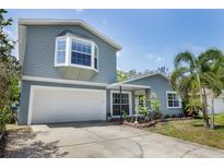 Charming two-story home with a two car garage, bay window and landscaping at 12913 126Th Ter, Largo, FL 33774