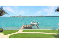 Waterfront property with private dock, boat lift, and stunning ocean views at 297 1St W St, Tierra Verde, FL 33715