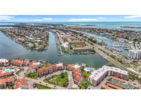 Stunning aerial view of waterfront community with boat docks and beautiful coastal scenery at 120 1St E St # 104, St Petersburg, FL 33715