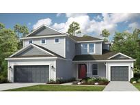 Charming two-story home with a well-manicured lawn, gray siding, and a welcoming front entrance at 1759 Longliner Loop, Wesley Chapel, FL 33543