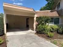 Charming home exterior featuring a carport and well-maintained landscaping at 2720 Sand Hollow Ct # 156A, Clearwater, FL 33761