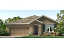 Charming single-story home featuring a two-car garage, stone accents, and a well-manicured lawn at 3529 Thistle Bank Ct, Plant City, FL 33565
