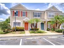 Charming townhome with colorful shutters and tropical landscaping at 11304 Cayman Key Ave # 2, Tampa, FL 33624