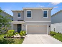 Charming two-story home with a two-car garage and well-maintained landscaping at 2449 Moon Shadow Rd, New Port Richey, FL 34655