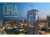 Striking exterior view of ORA high-rise condos, featuring city views and rooftop helicopter pad at 1101 E Jackson St # 2502, Tampa, FL 33602
