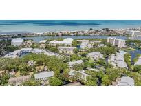 An aerial view of a coastal community with lush landscaping, water features and nearby ocean access at 11440 Harbor Way # 5009, Largo, FL 33774