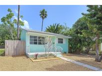 Charming single-story home featuring a quaint front porch and tidy landscaping at 627 64Th S Ave, St Petersburg, FL 33705