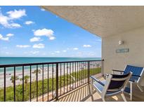 Relax on the balcony with a beautiful view of the beach and ocean at 15000 Gulf Blvd # 602, Madeira Beach, FL 33708